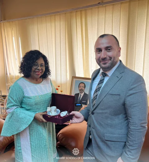 Cameroons' Minister of Secondary Education, H.E PAULINE EGBE NALOVA LYONGA receives the T M F Cameroon Country Representative. 